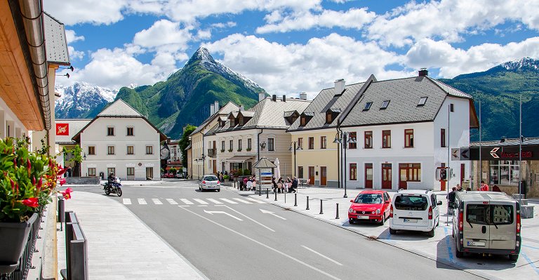 View of the main square of Bovec with the Svinjak mountain in the background
